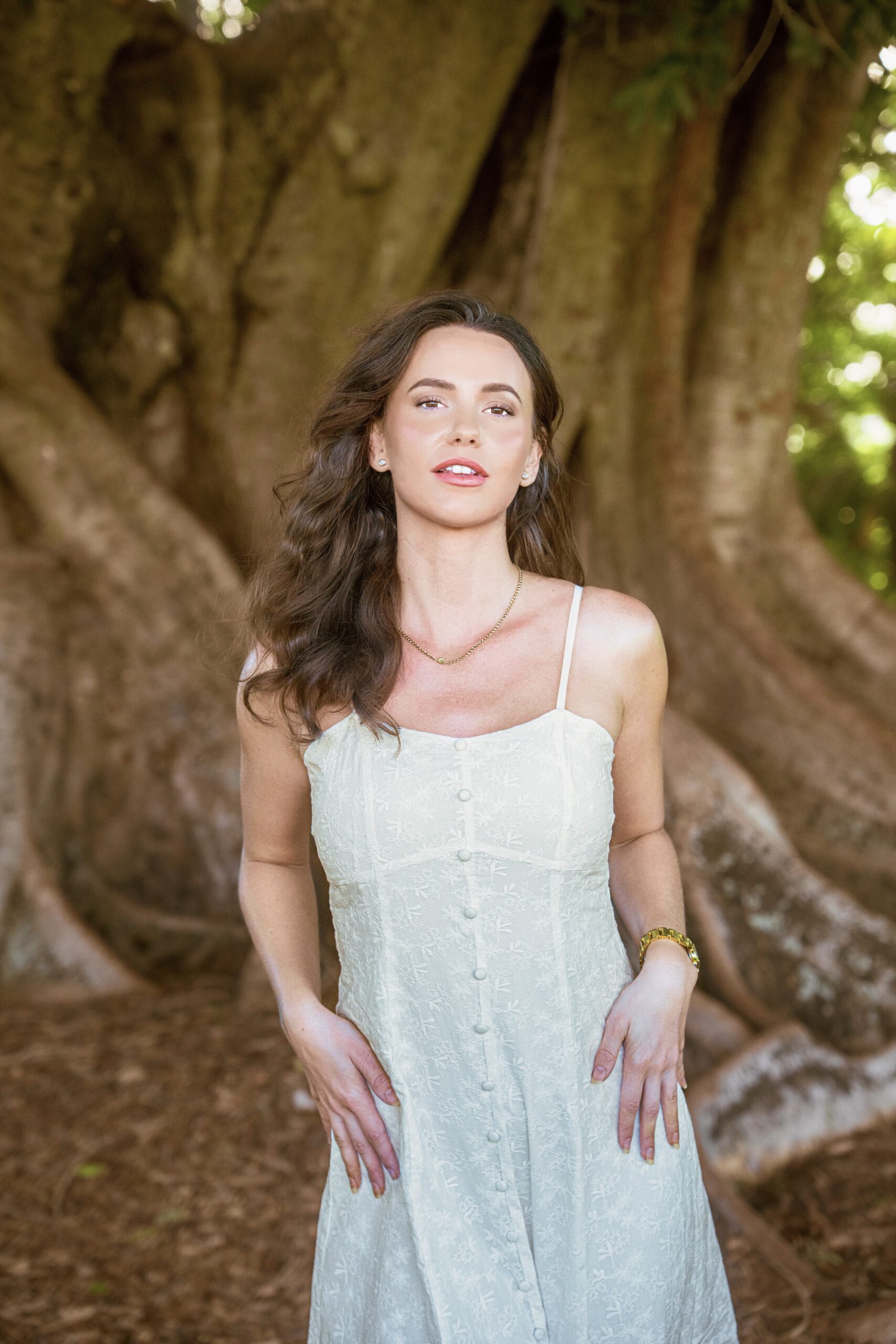 Camellia Midi Dress — close-up of intricate white-on-white embroidery and faux button detail on cotton fabric | La Mira Singapore