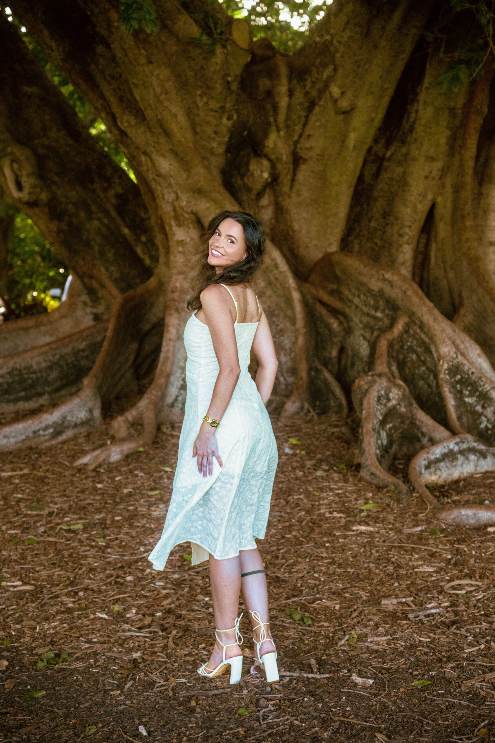 Camellia Midi Dress — side view showing fitted waist silhouette and midi length of white embroidery dress | La Mira Singapore