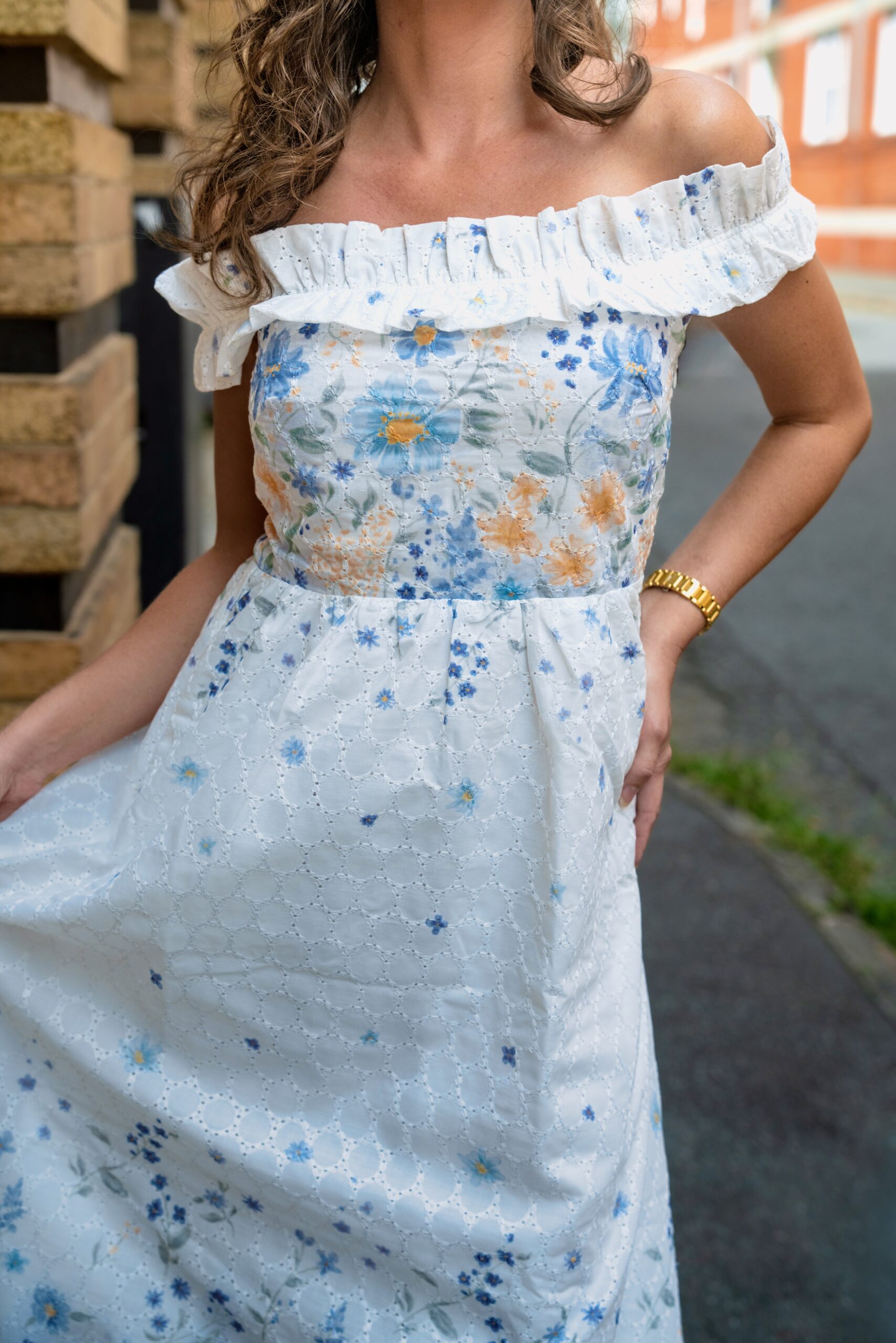 Clarisse Off Shoulder Maxi Dress White Blue — close-up of blue floral broderie anglaise embroidery and frill detail | La Mira Singapore