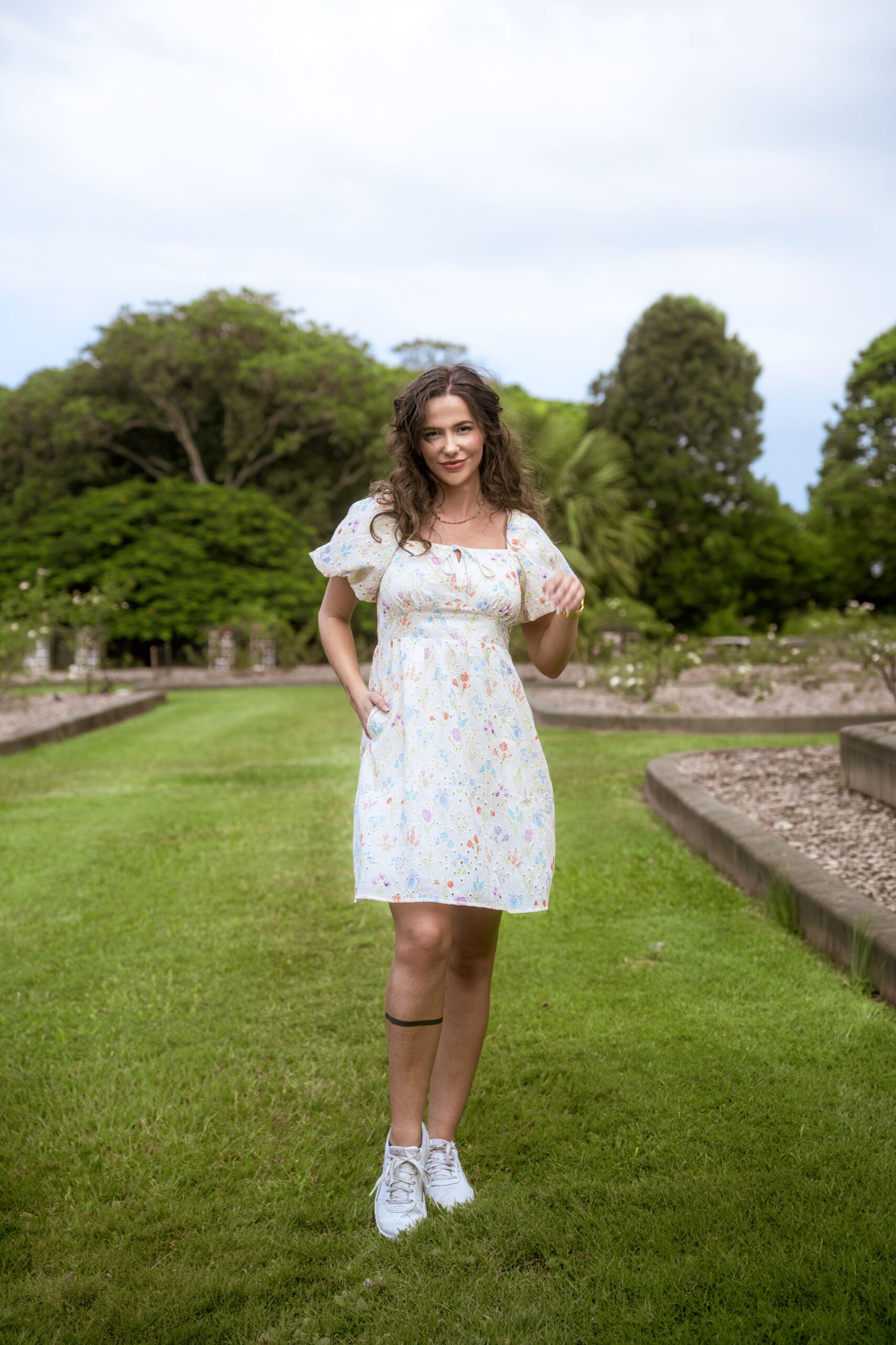 Aria Babydoll Dress — white broderie anglaise mini dress with pastel florals, front full view | La Mira Singapore