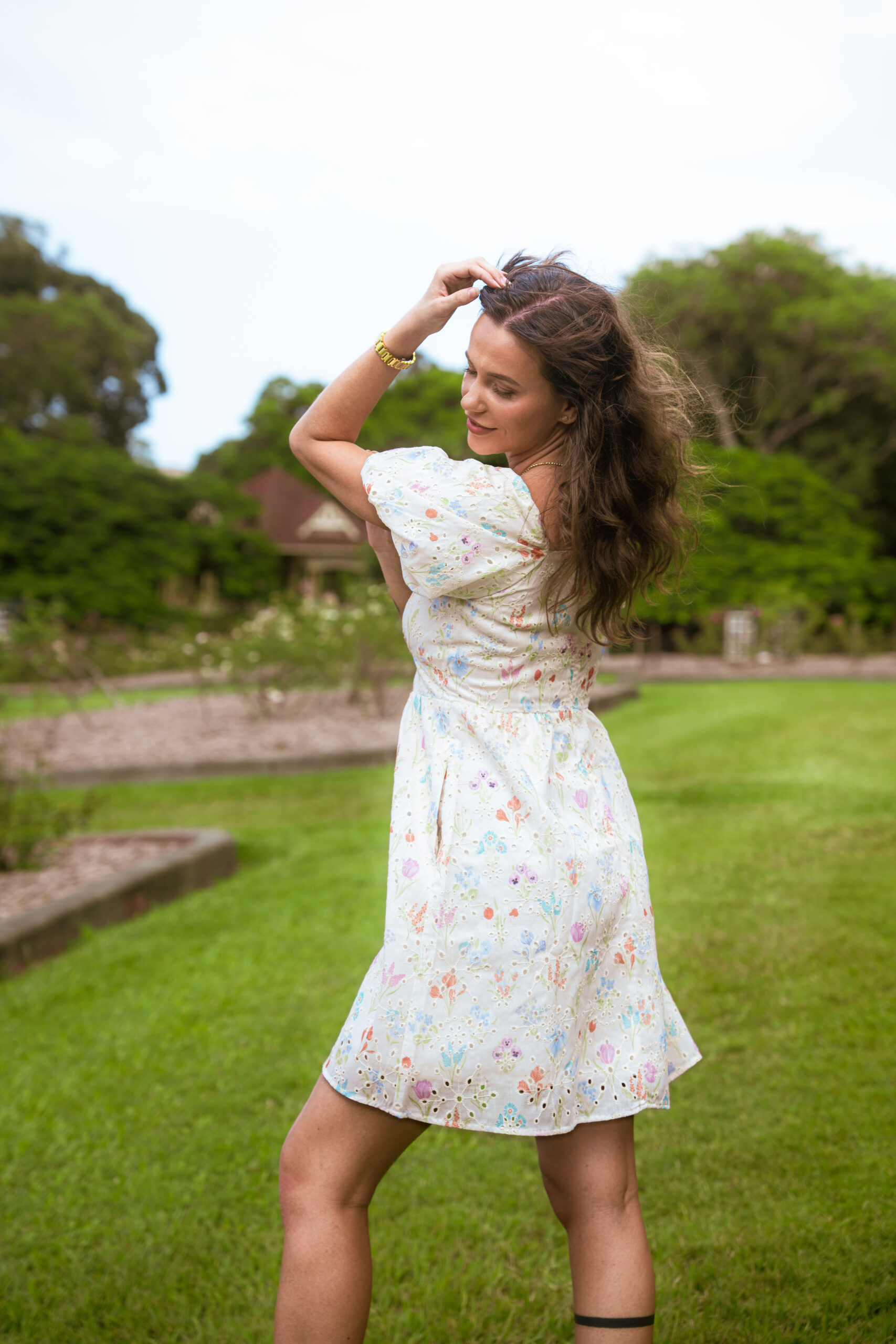 Aria Babydoll Dress — side view showing babydoll silhouette and cotton lawn fabric drape | La Mira Singapore