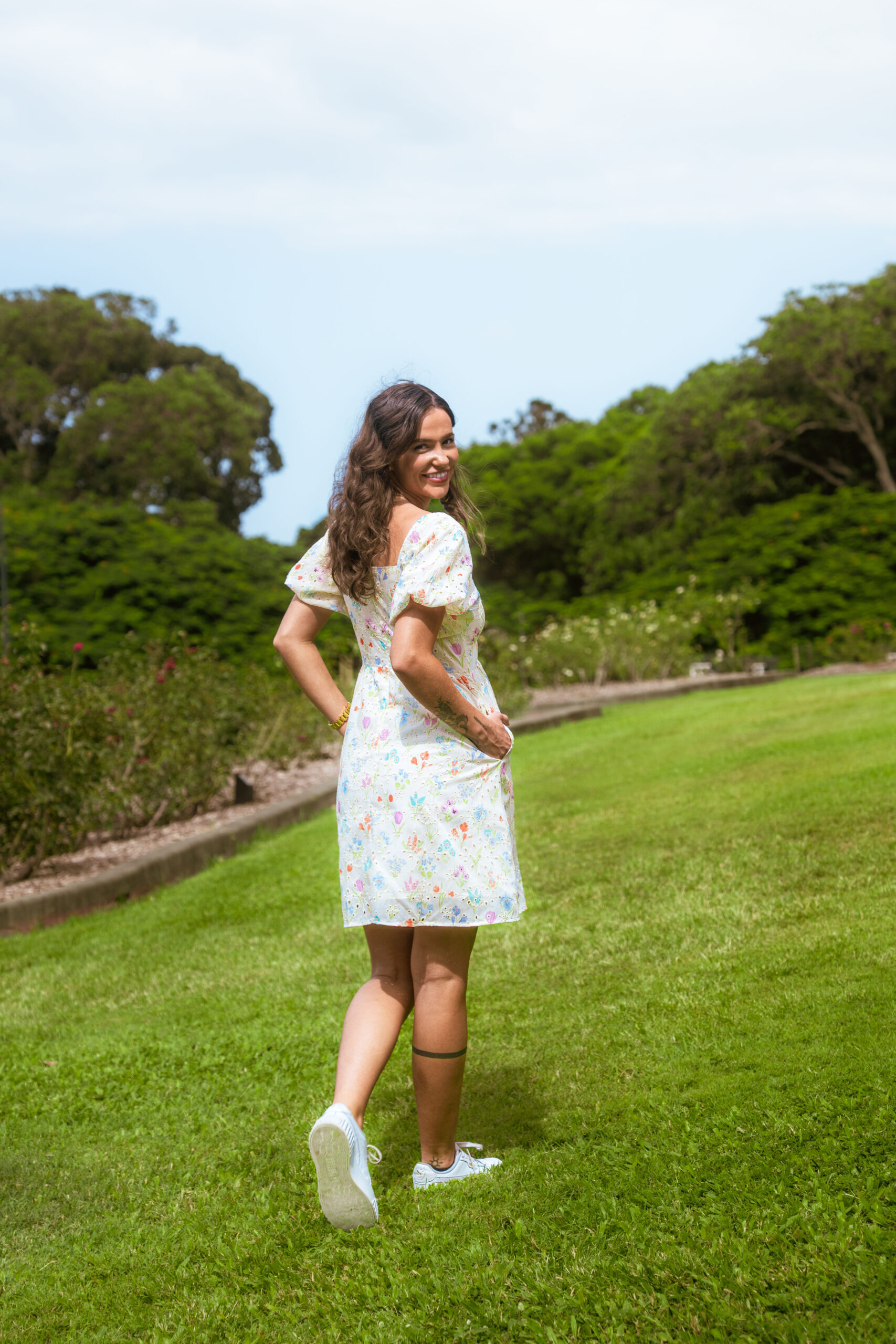 Aria Babydoll Dress — back view with concealed zip closure on white broderie mini dress | La Mira Singapore