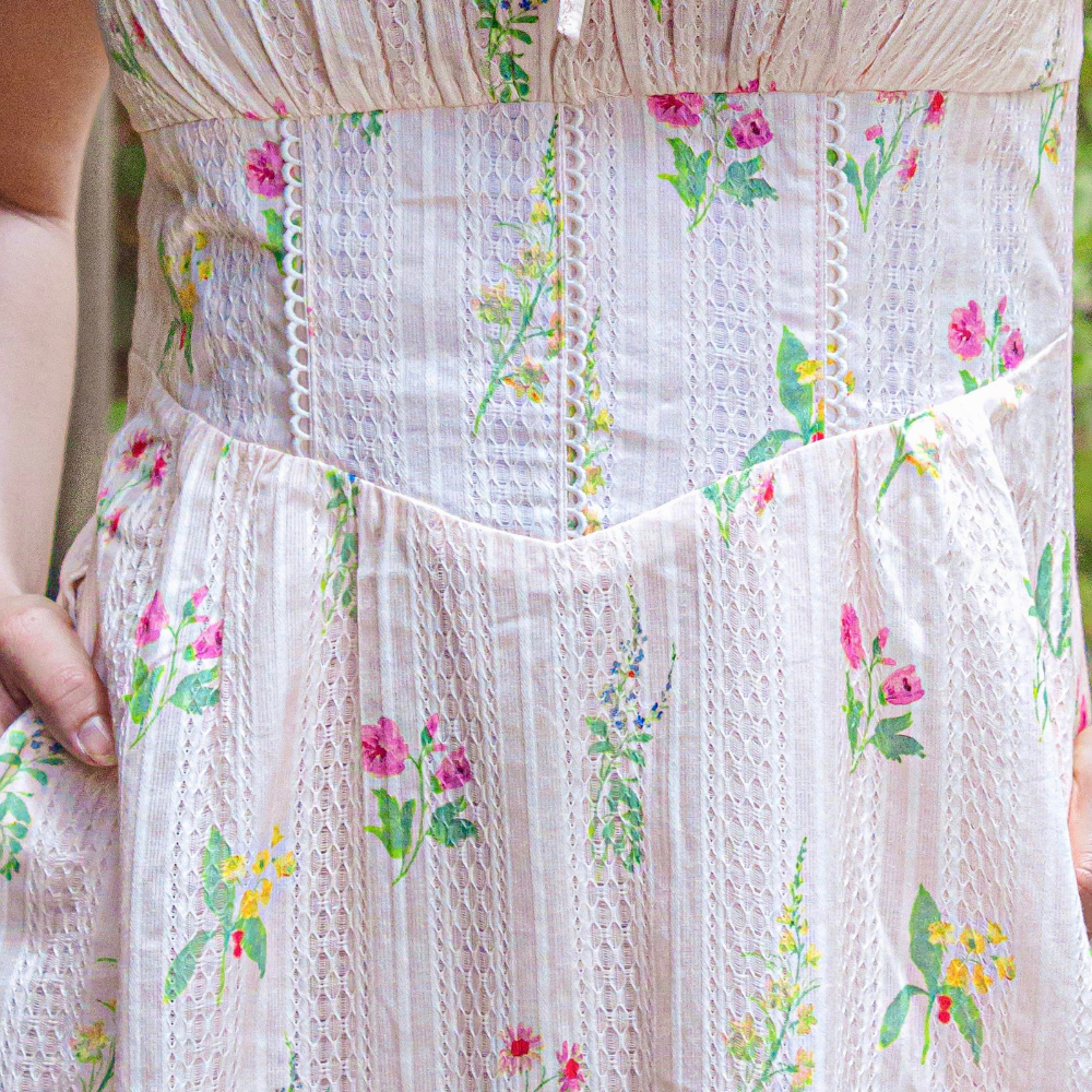 Anais Midi Dress — close-up of lace lattice overlay texture, floral print, and decorative tie-front neckline detail | La Mira Singapore